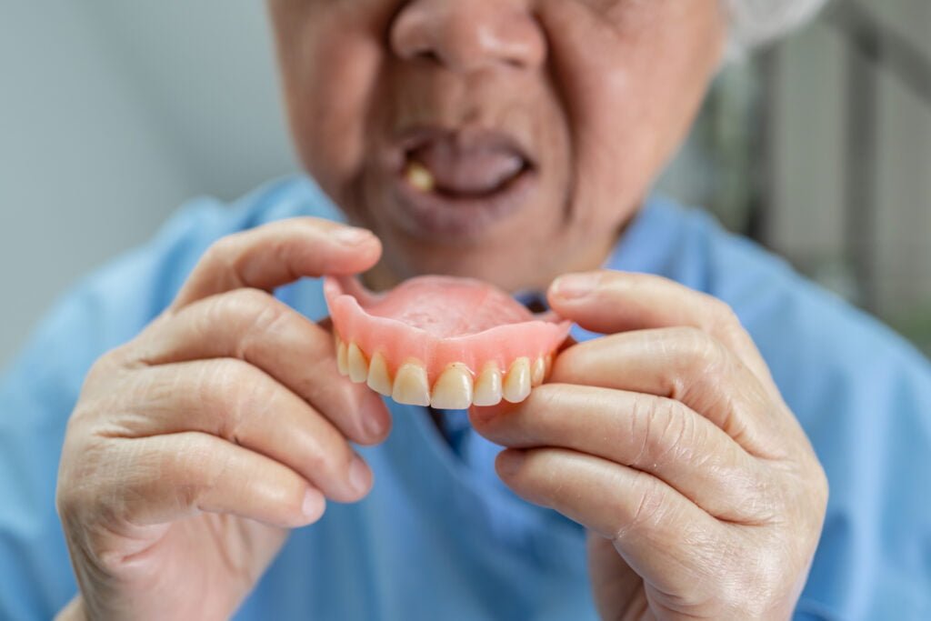 old asian man with dentures 