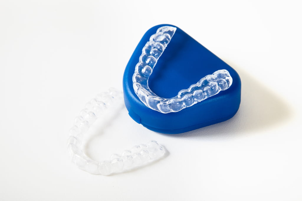 pair of aligners one on surface one on tray 